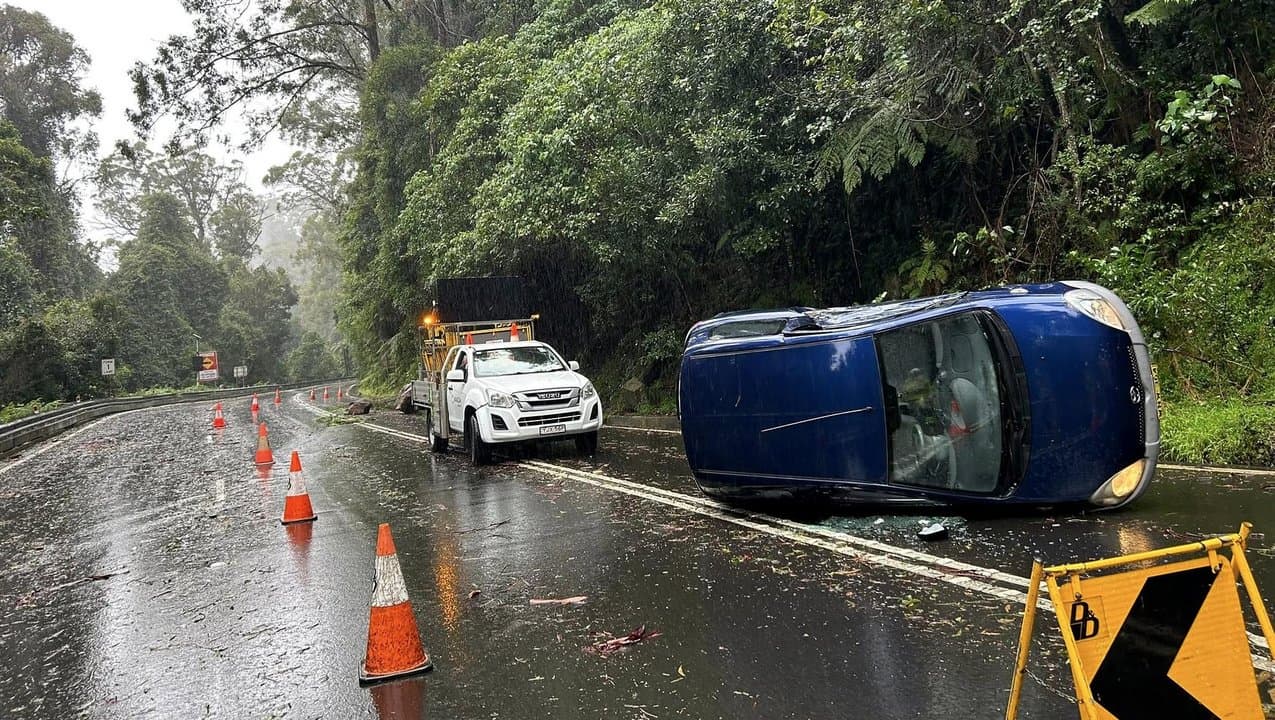 A car on its side on Macquarie Pass south of Wollongong,