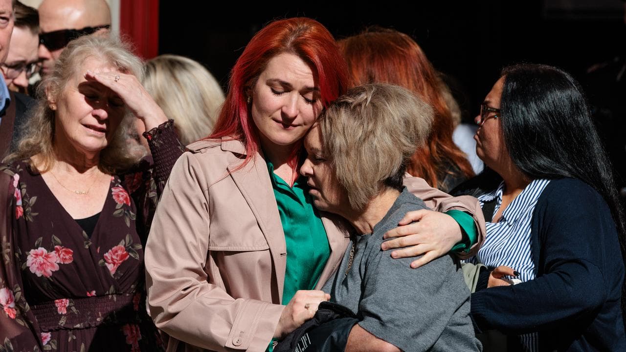 Emily and Natalie Woods console each other