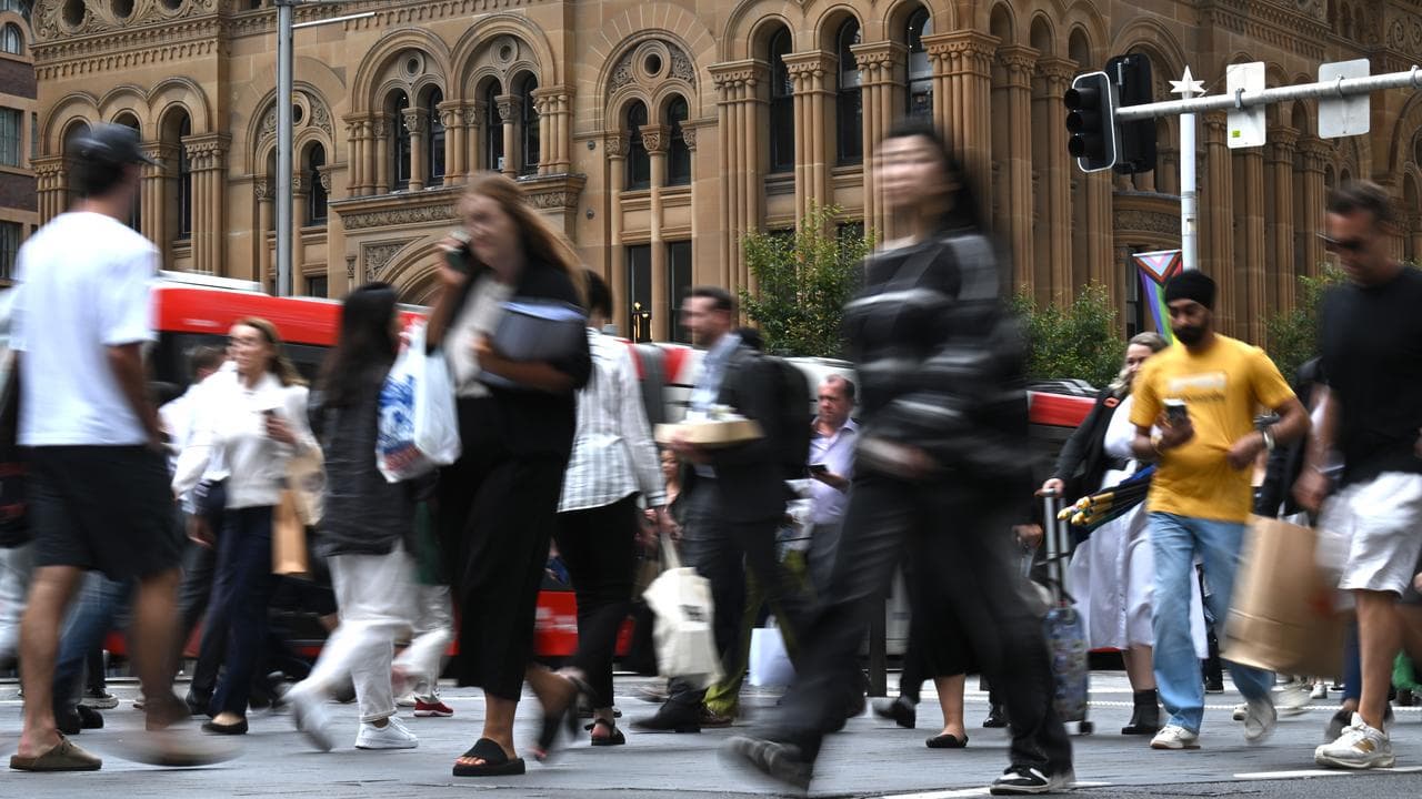 People walking across a street (file image)
