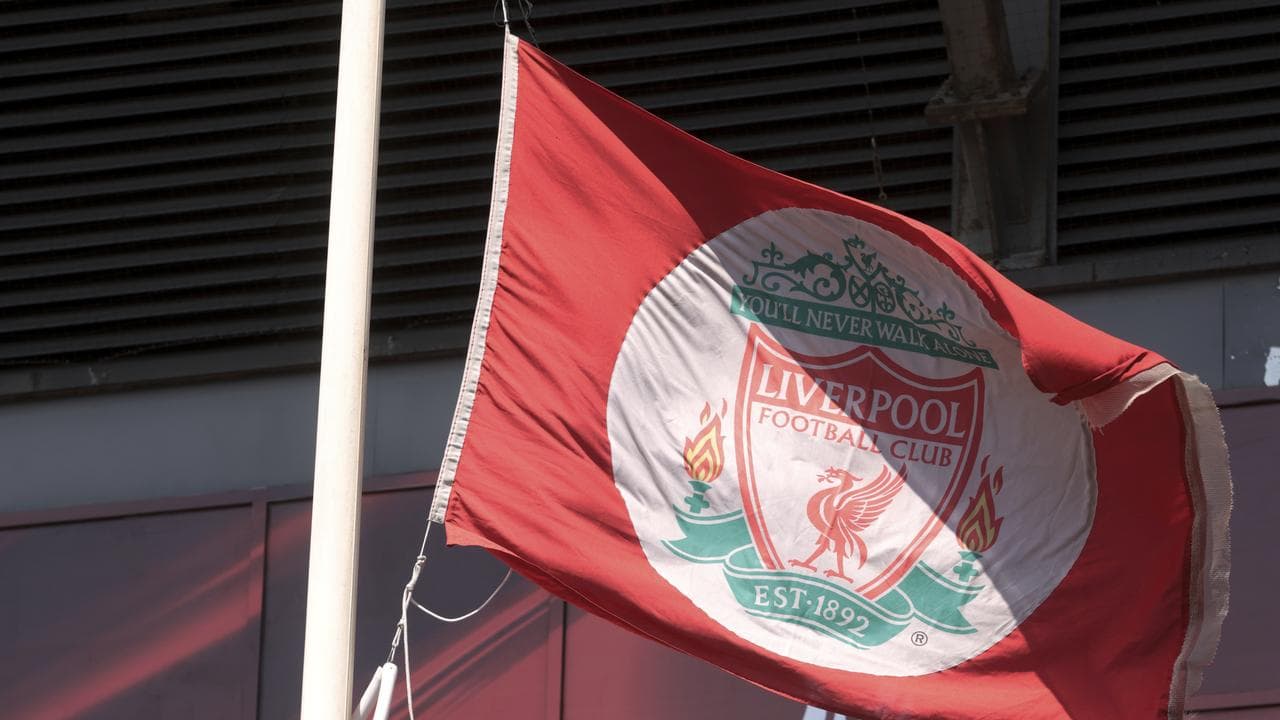 The Liverpool club flag flies at half mast in memory of Diogo Jota.