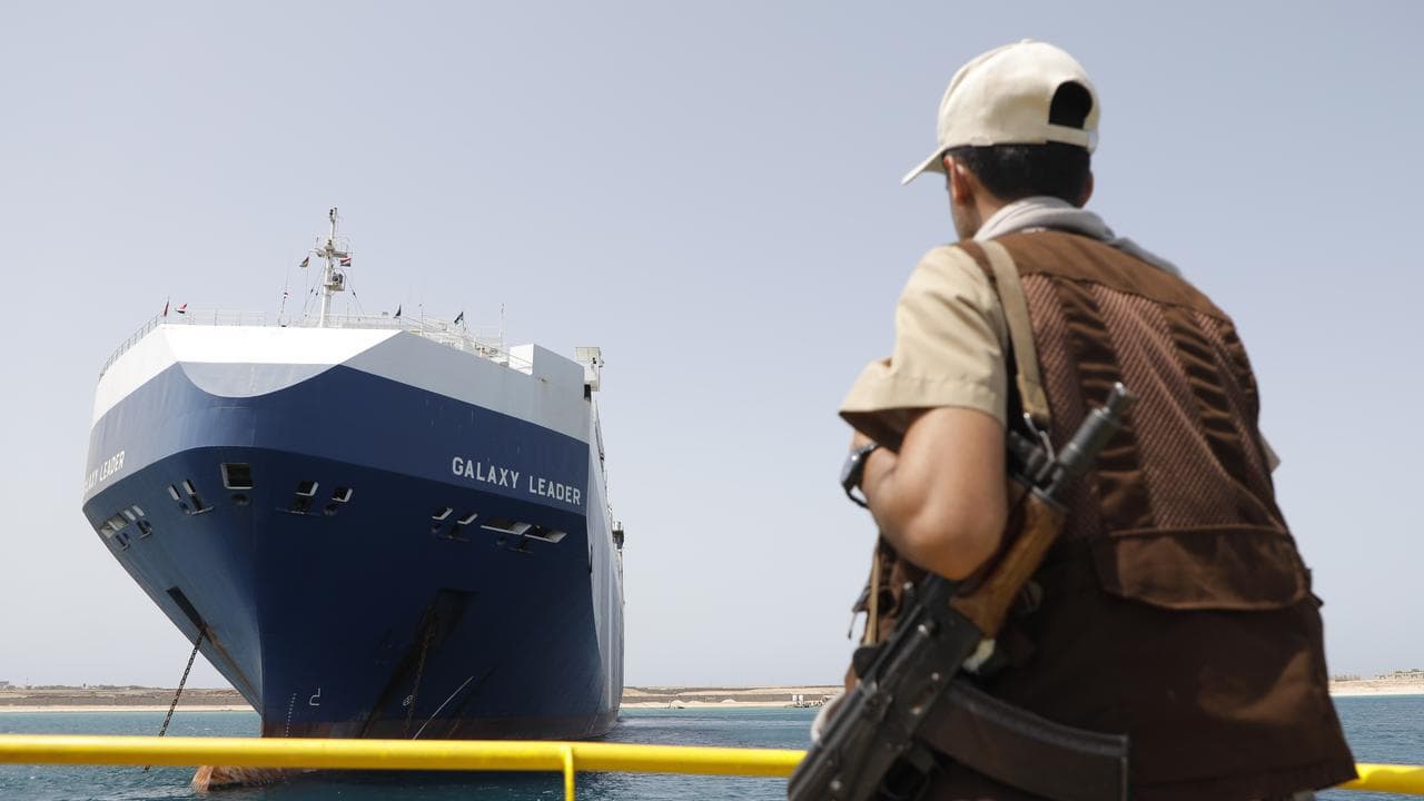 Houthi solder near captured Israeli ship Galaxy Leader