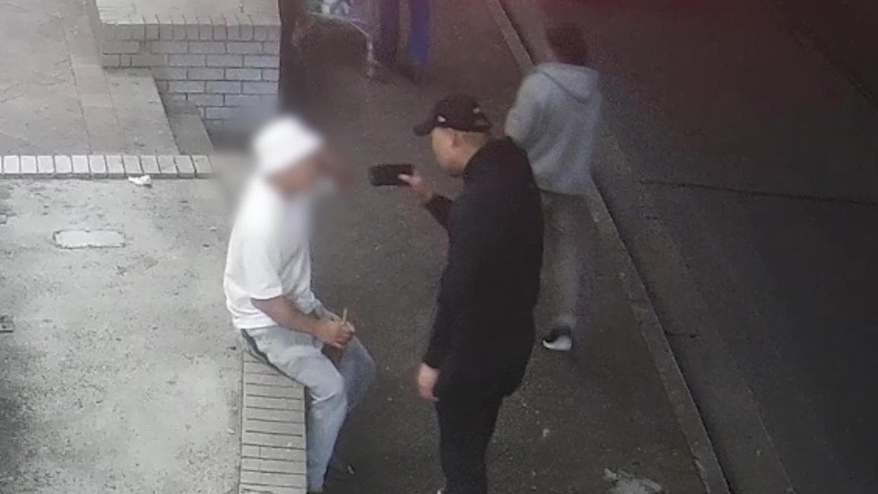 Rich Choup being slapped and reprimanded by another man in Sydney