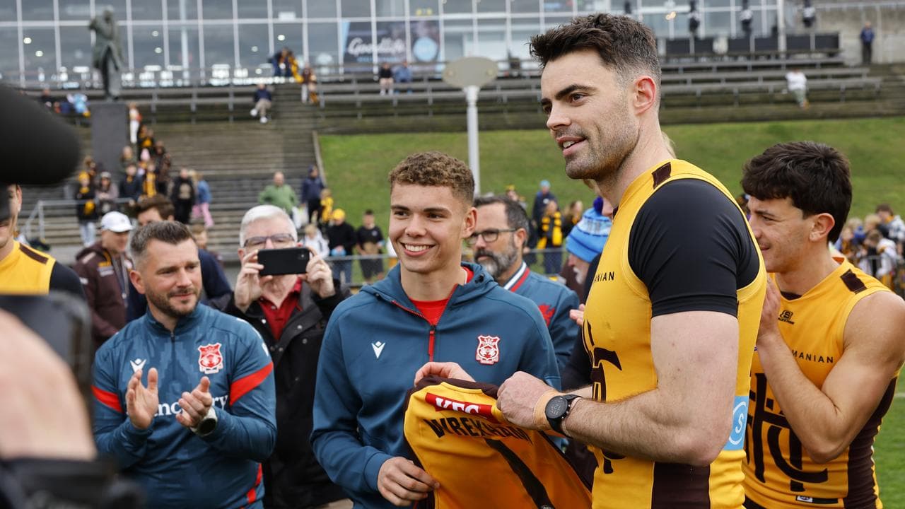 Alex Moore of Wrexham FC and Conor Nash of the Hawks