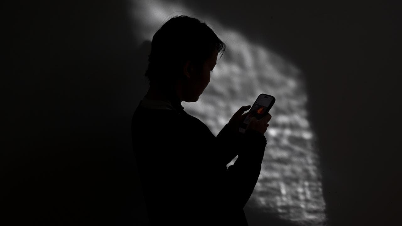 A woman on her mobile phone (file image)