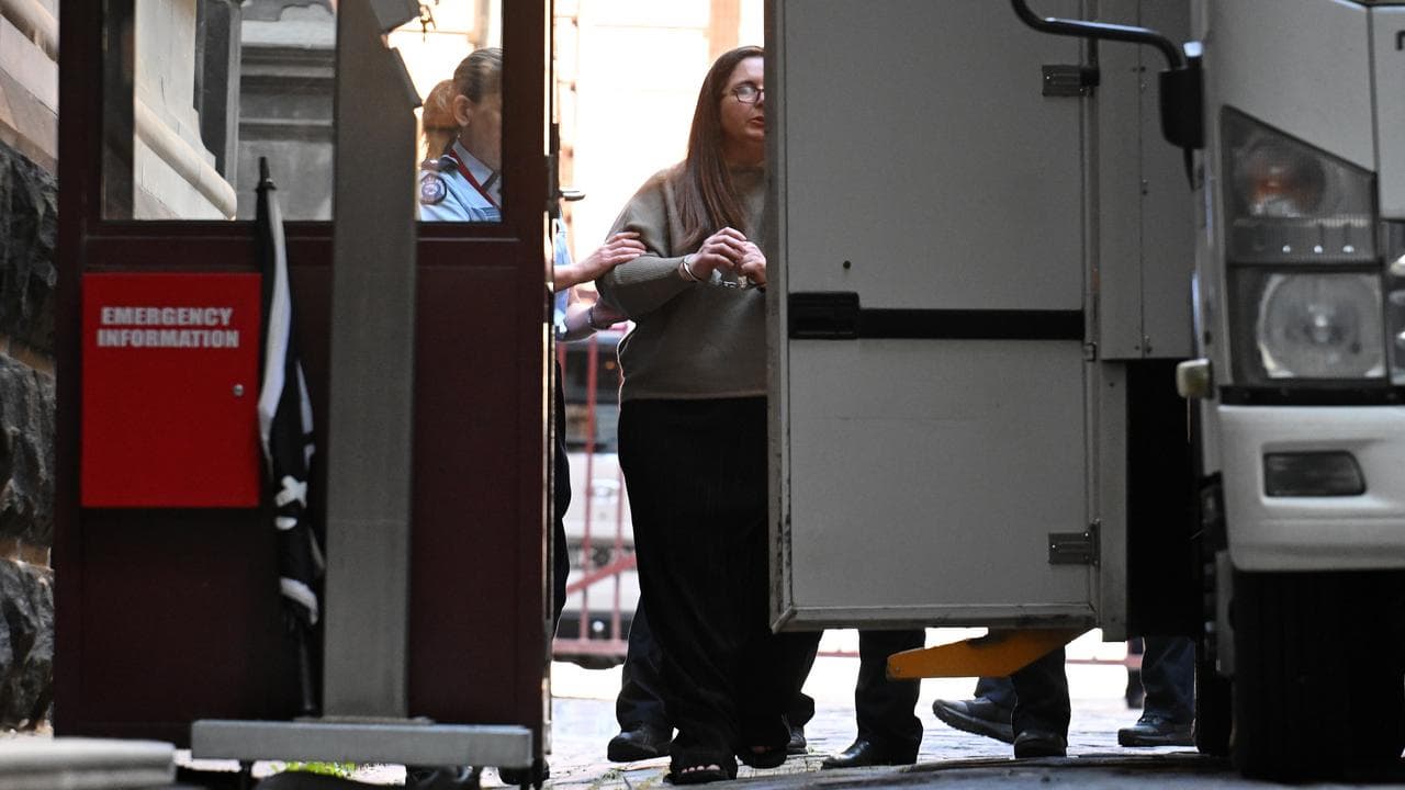 Erin Patterson (centre) departs from the Supreme Court of Victoria