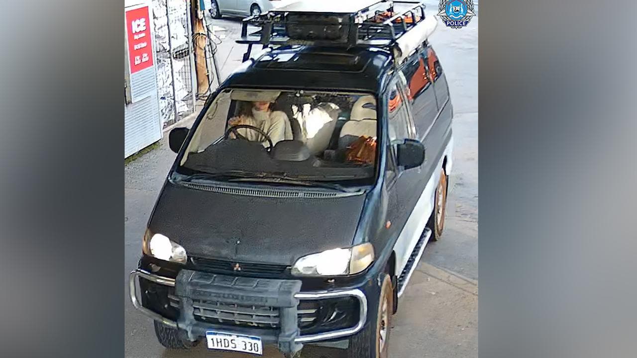 A black and silver 1995 Mitsubishi Station sedan