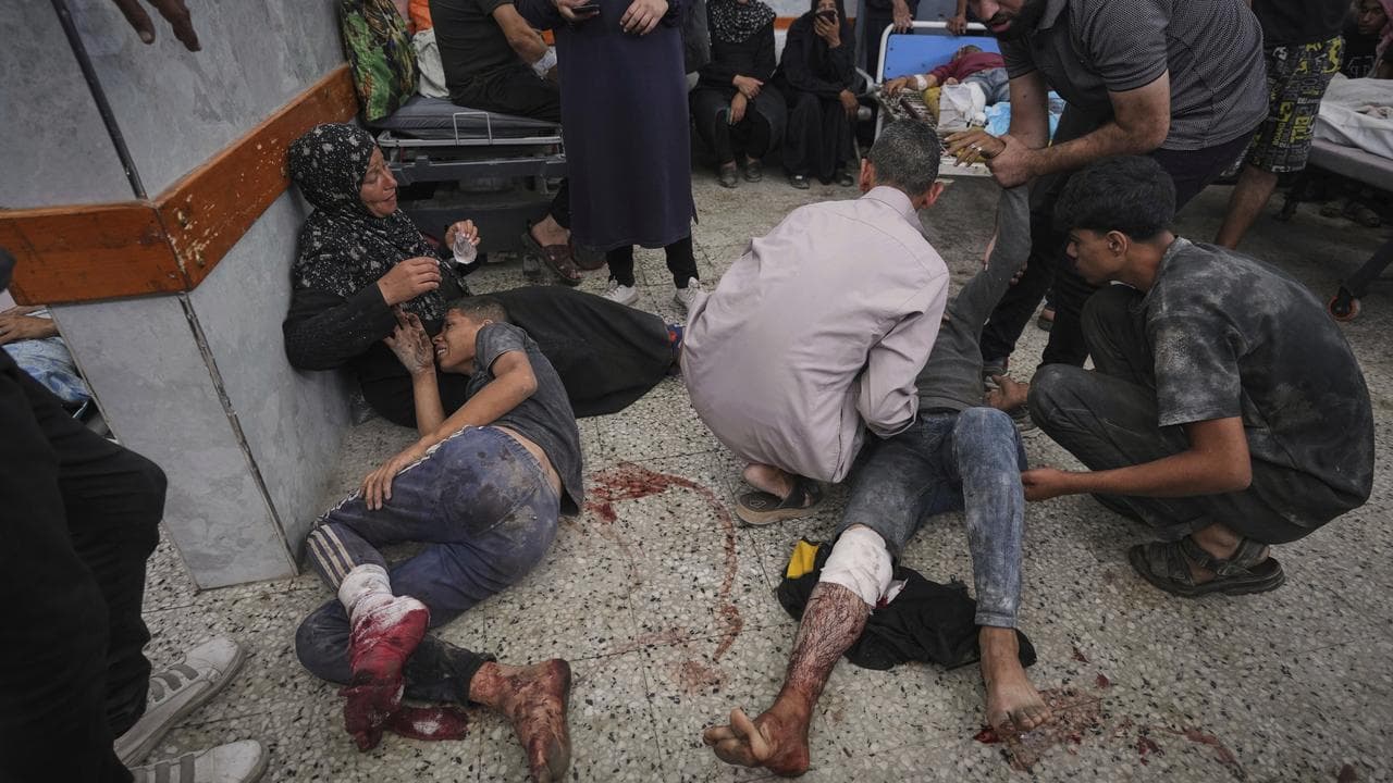 Palestinians are brought to Shifa Hospital after being wounded