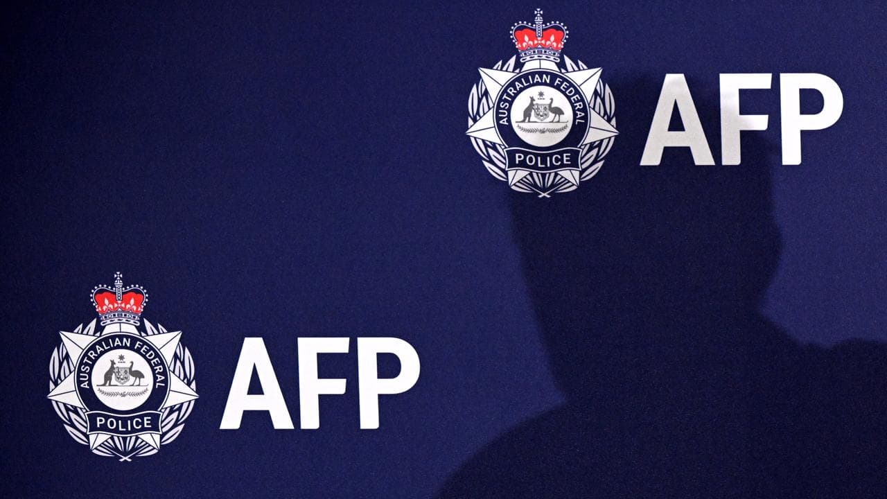 Australian Federal Police logo at a media conference in Brisbane