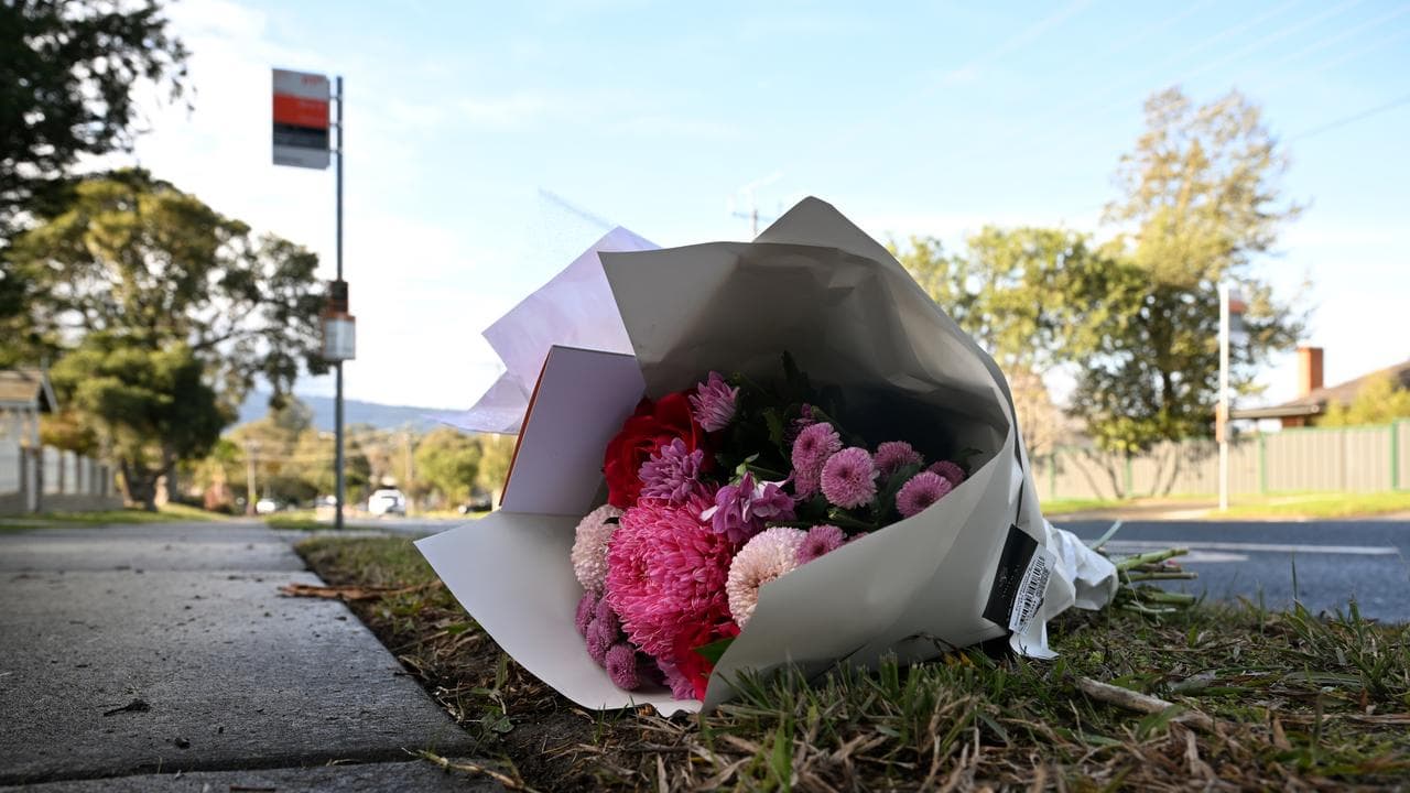 Floral tributes left at a bus stop near the crash scene