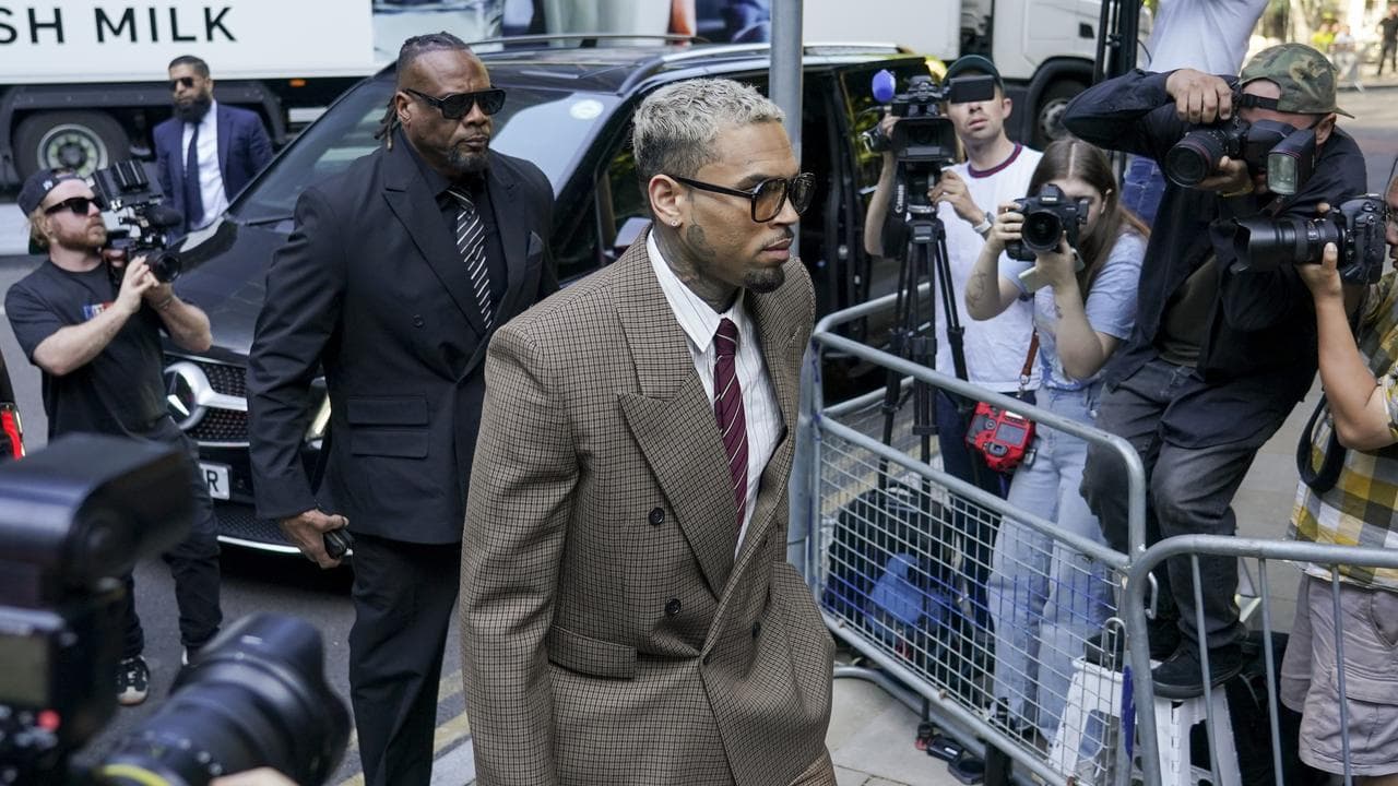 Chris Brown makes his way into Southwark Crown Court, London