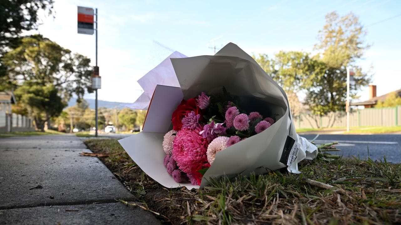 Floral tributes left at a bus stop