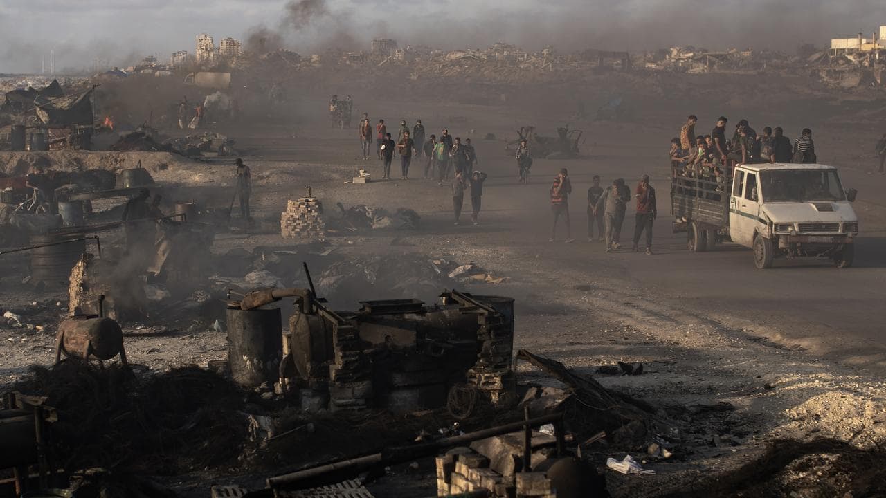 Palestinians gather to receive aid