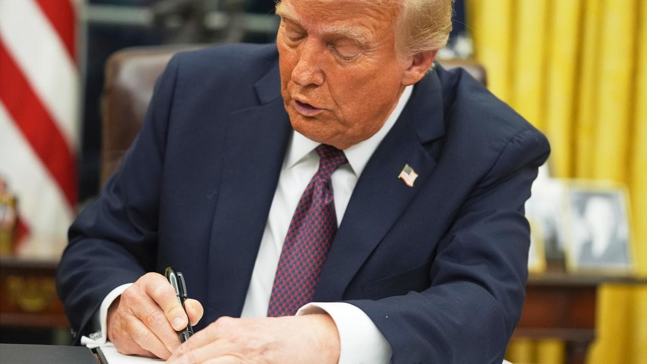US President Donald Trump signs an executive order