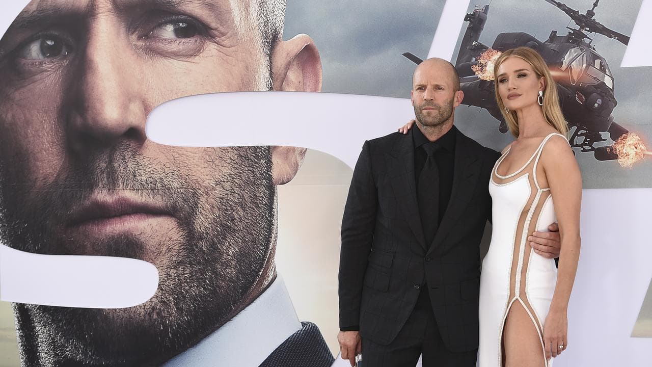 Jason Statham and Rosie Huntingon-Whitely at a film  premiere.