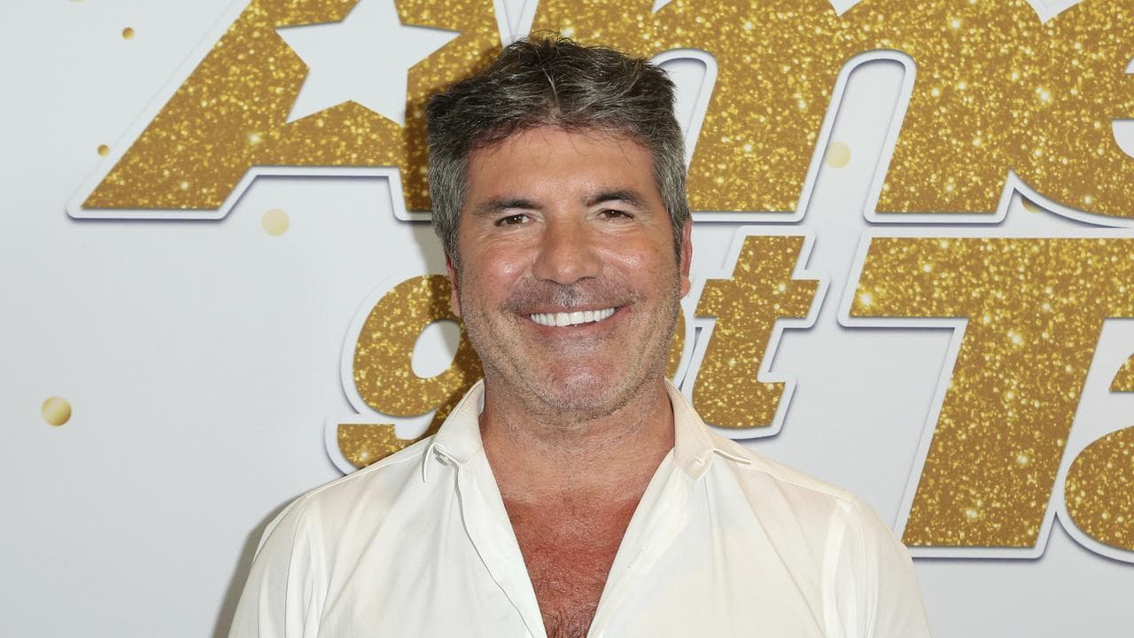 Simon Cowell attending a red carpet.