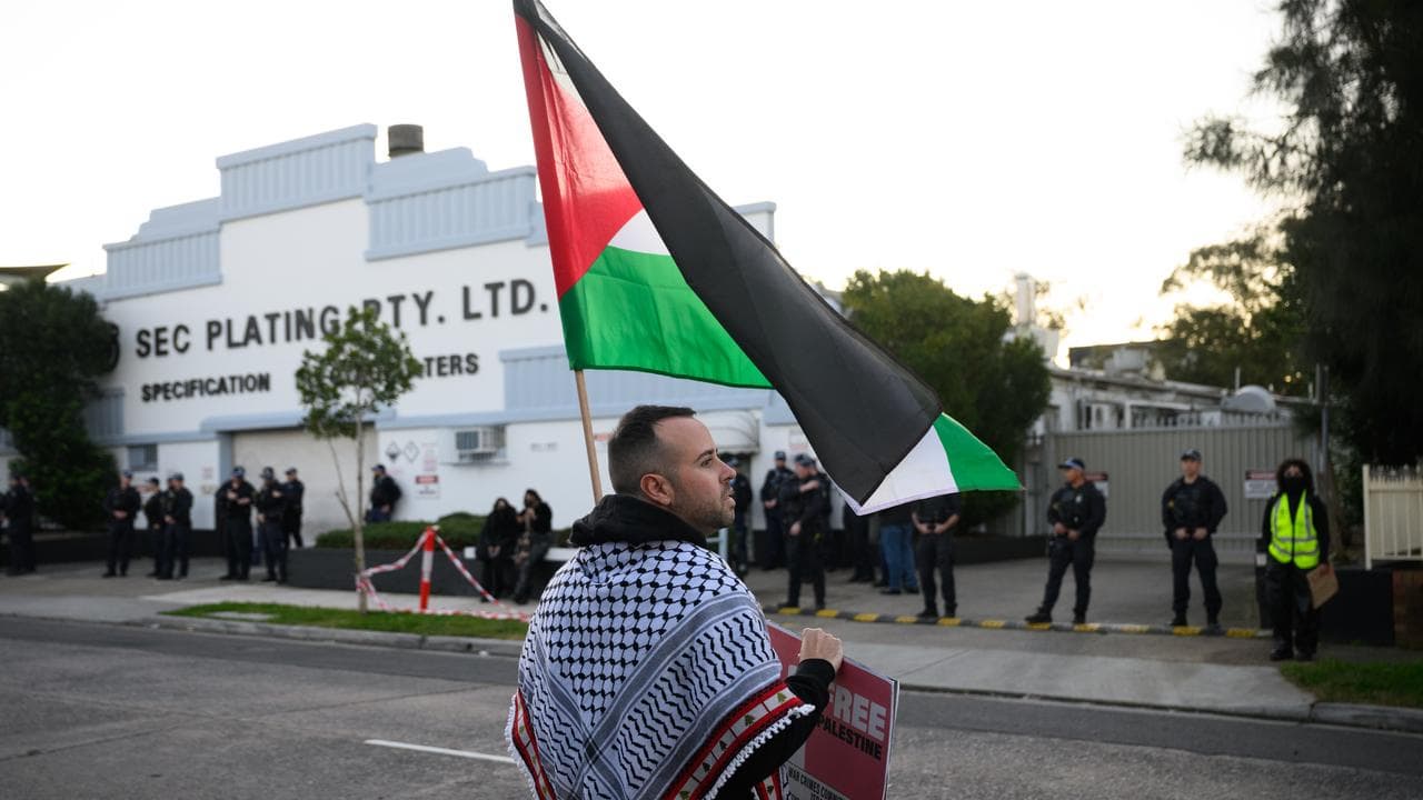 A protester outside SEC Plating in Belmore (file image)