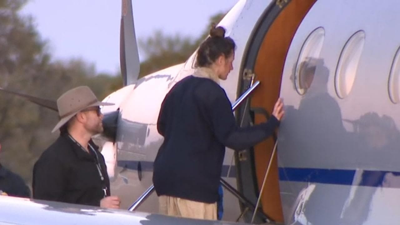 Carolina Wilga boards a plane.