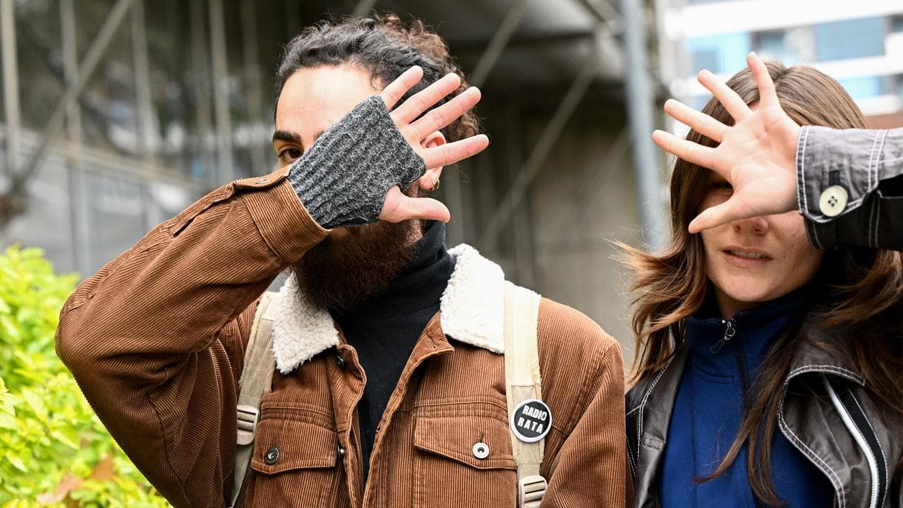 Brandon Eid (left) leaves court