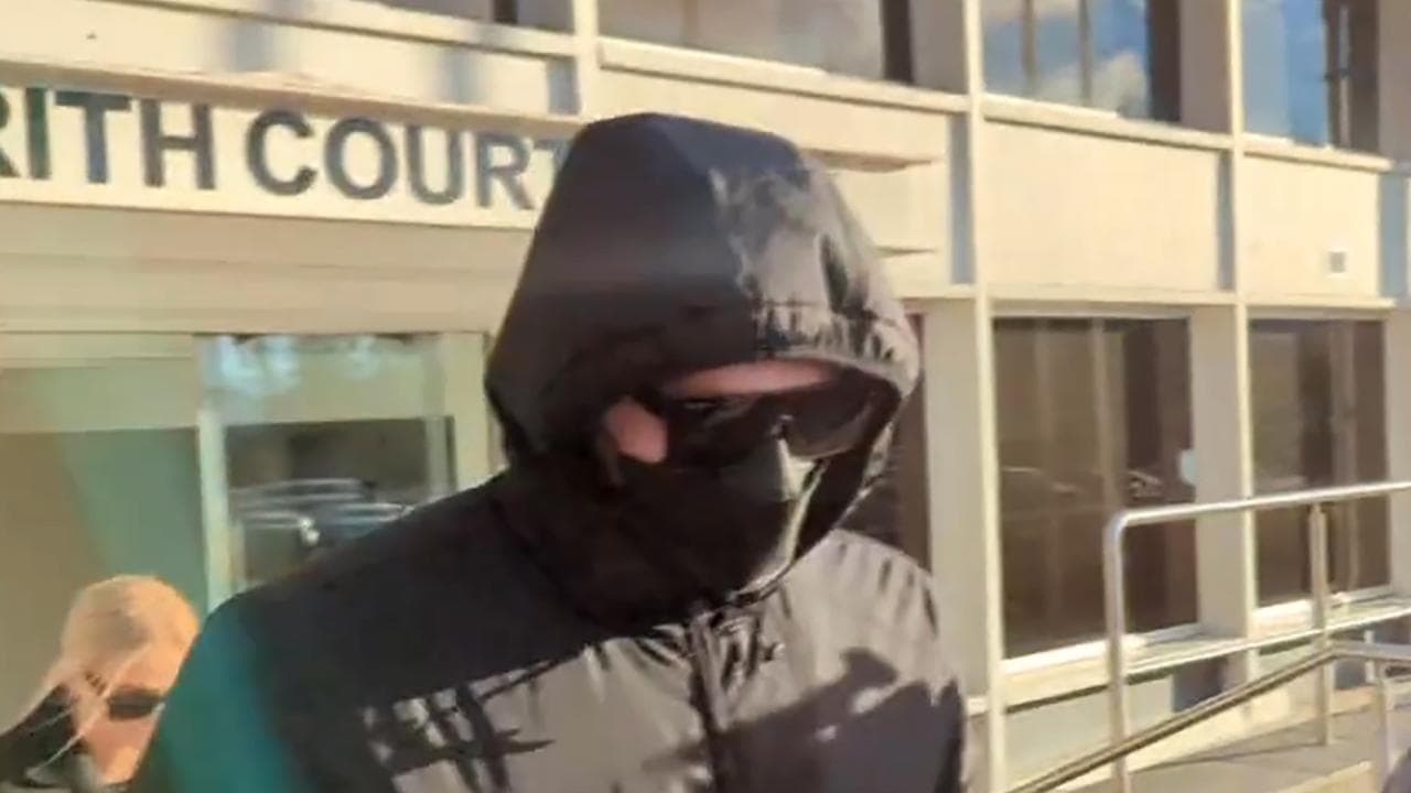 Nathan Black in mask, glasses and hoodie leaving court