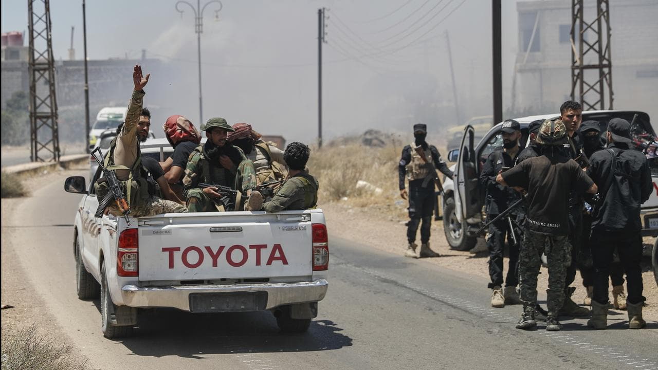 Syrian government forces gather on the outskirts of Sweida city, Syria