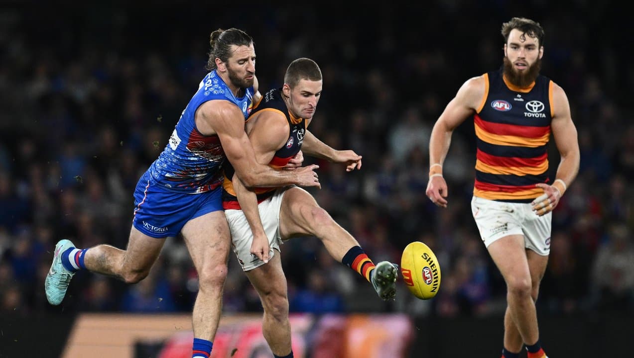 (L-R) Marcus Bontempelli tackles Sam Berry.