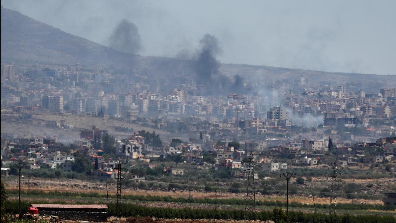 Smoke from clashes between Syrian forces and Druze militias in Sweida