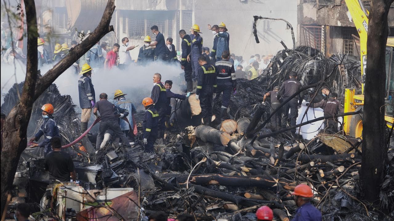 Search teams respond to the scene of a plane crash in Ahmedabad, India