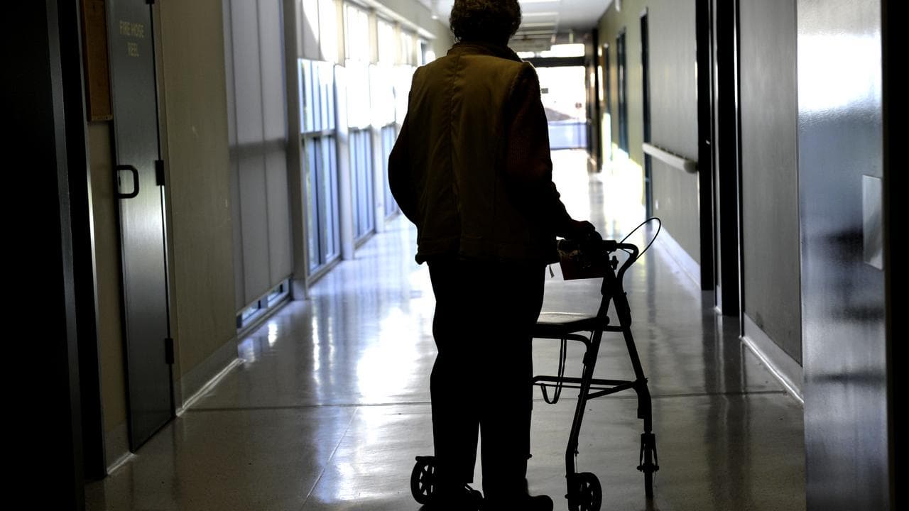Woman uses a walker in Canberra, 2013
