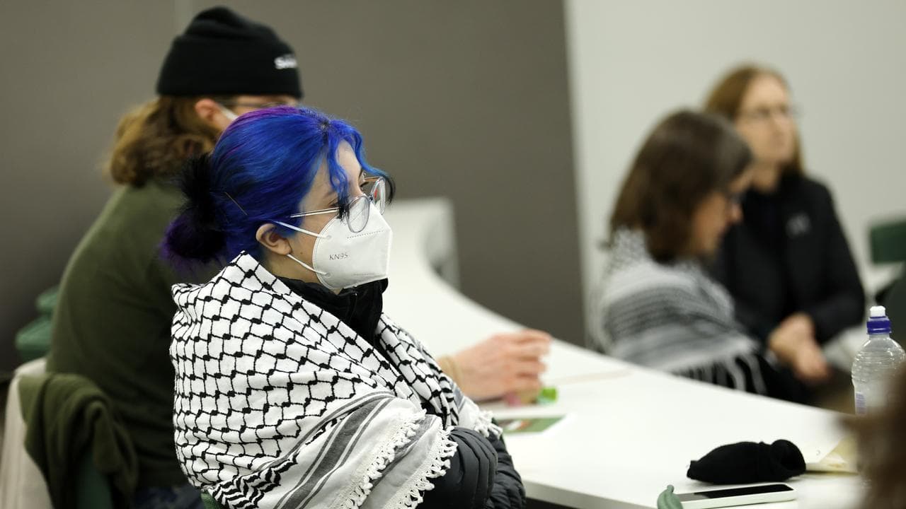 People attend an inquiry into freedom of speech