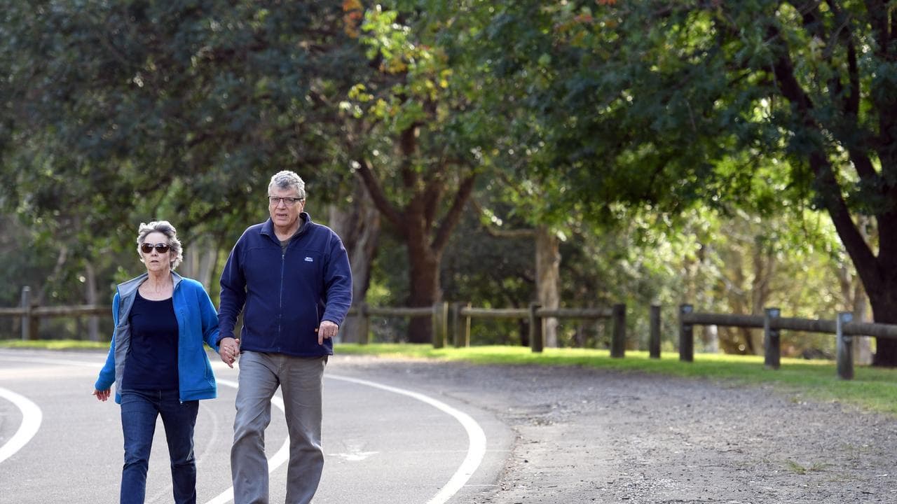 Couple walk in a park