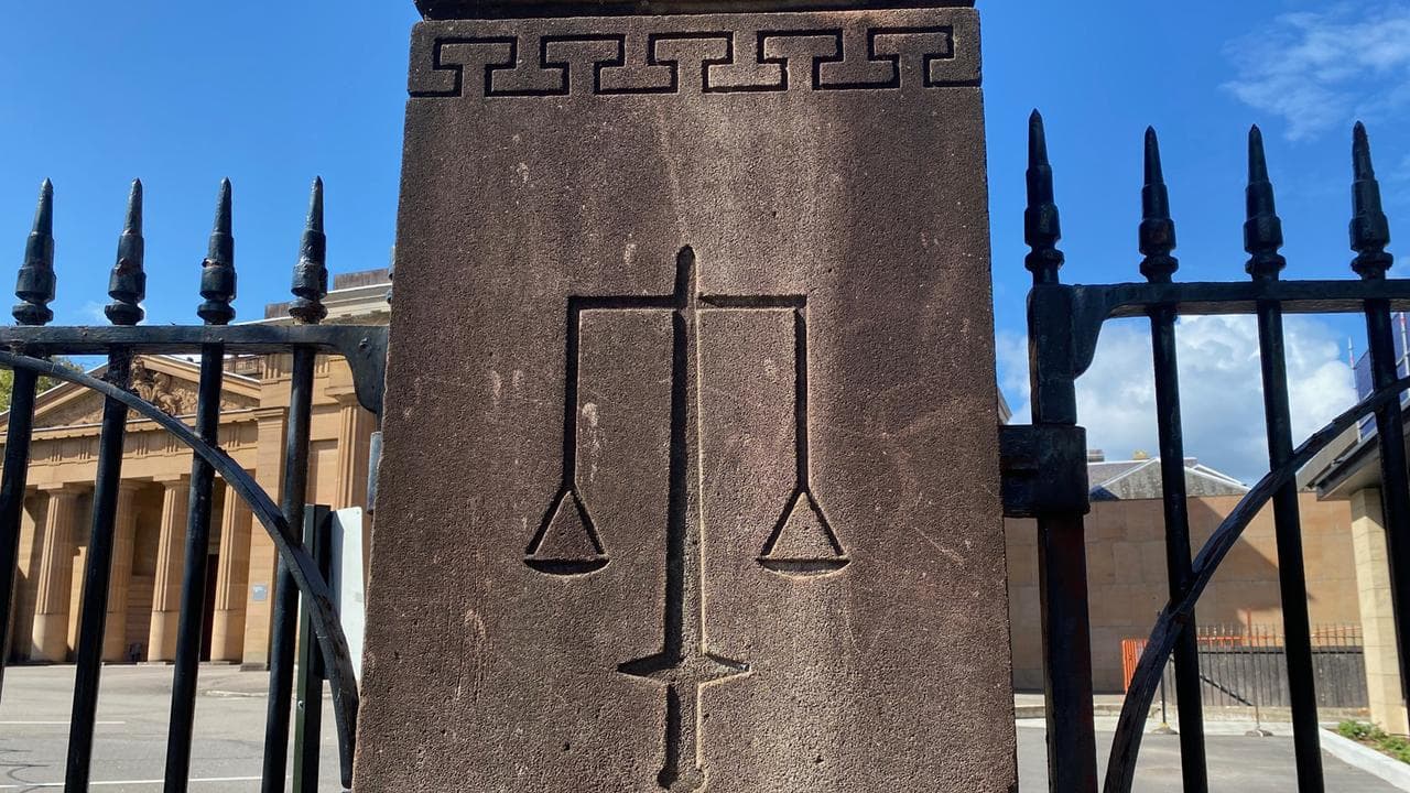 The scales of justice engraved on a pillar outside court (file)