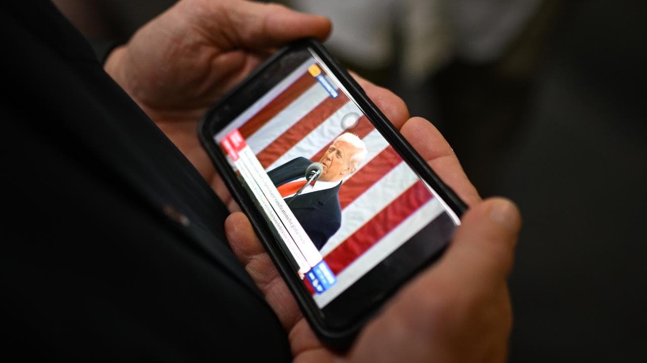 President Donald Trump seen on a phone