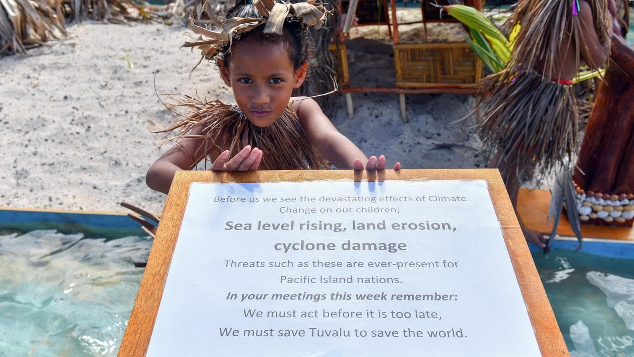 Child holds sign in Vanuatu