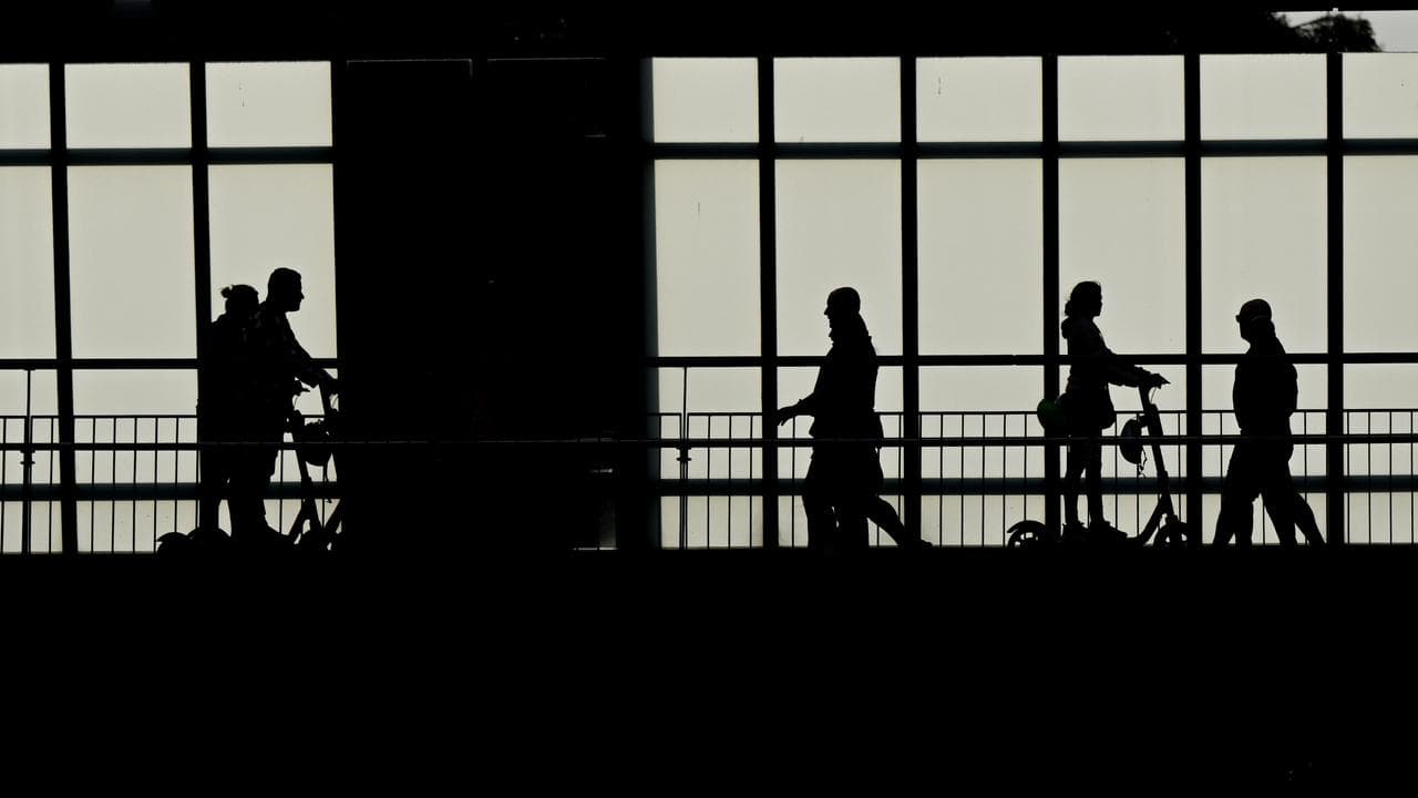 Pedestrians and people riding electric scooters