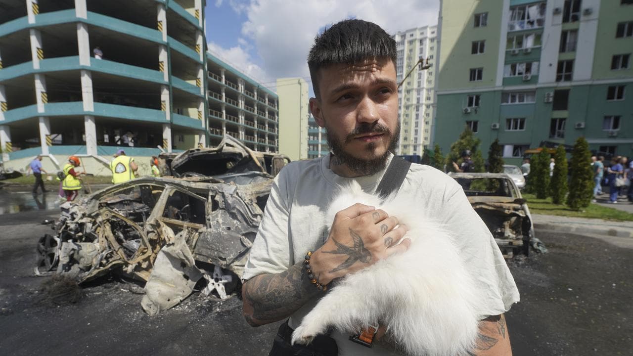 A file photo of a Kharkiv resident and his dog 