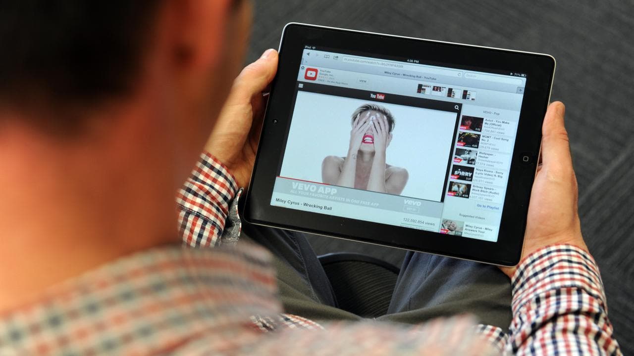 A person watching a YouTube video