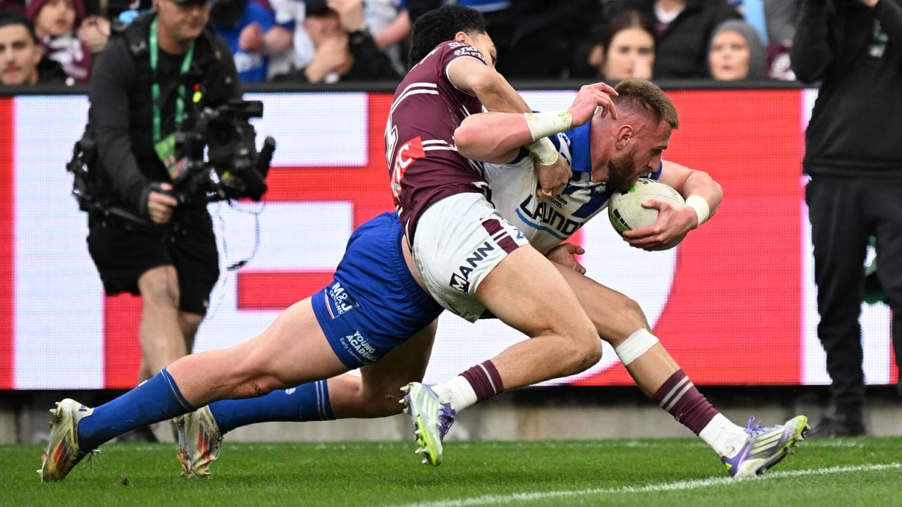 Manly's Lehi Hopoate can't stop Canterbury's Samuel Hughes.