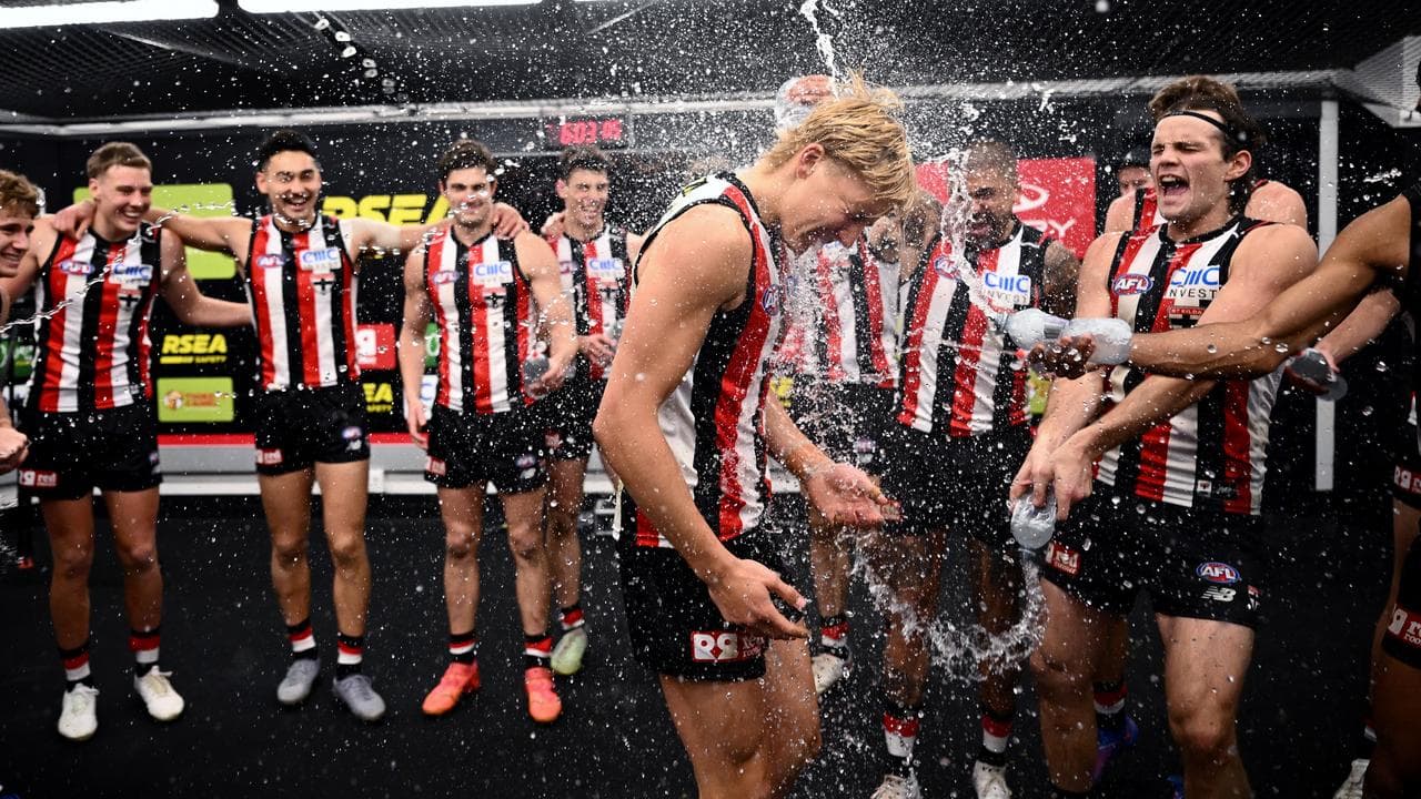 St Kilda players celebrate in the dressing room.