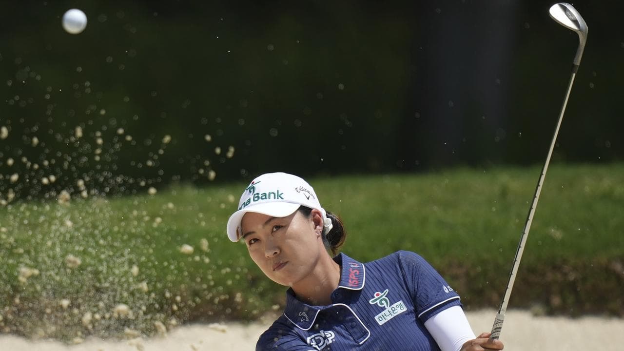 Minjee Lee, of Australia, hits from the bunker.
