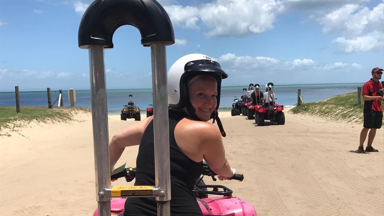 Woman sits on quad bike