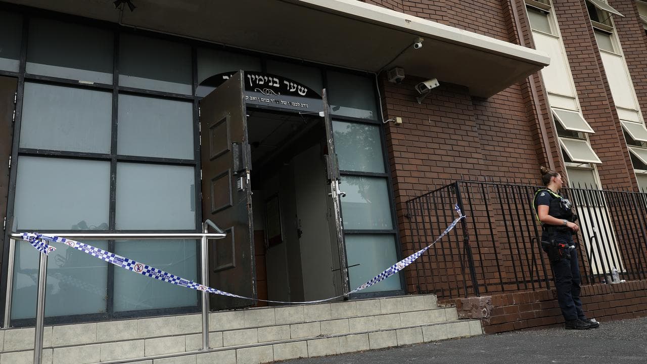 Police at the scene of an arson attack on the Adass Israel Synagogue