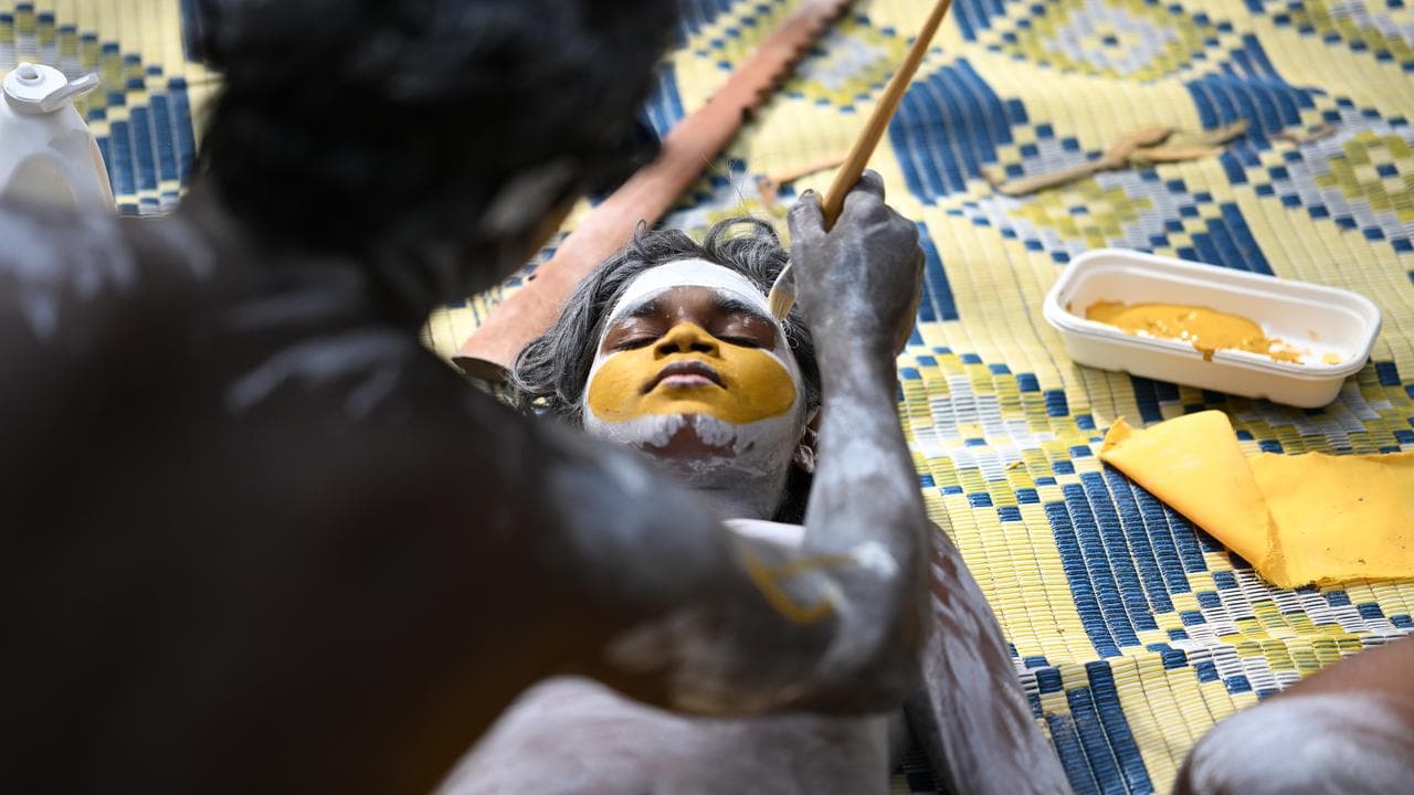 Garma attendees prepare for the Bunggul traditional dance