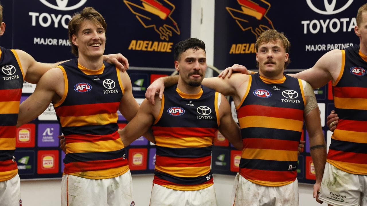 Adelaide players sing the team song.