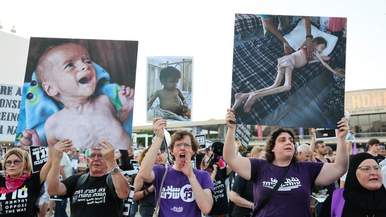 Israeli and Arab activists take part in a rally.