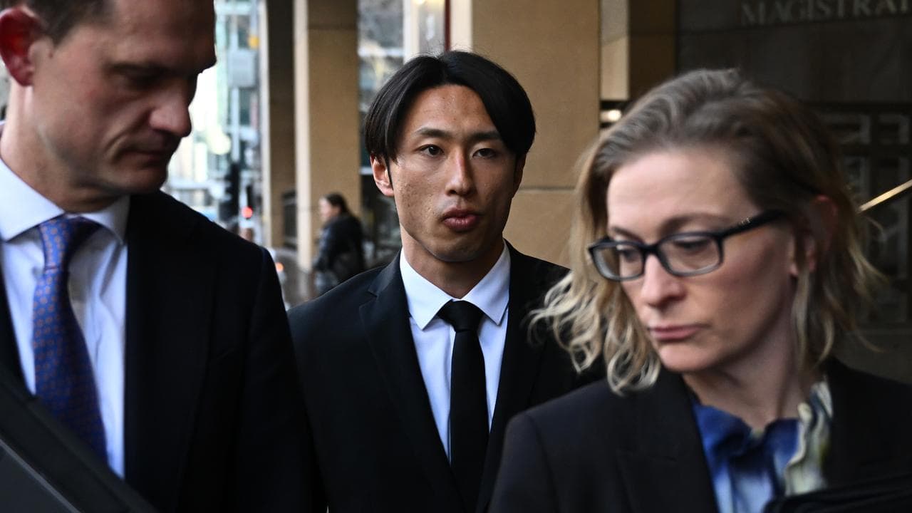 Riku Danzaki (centre) leaves Melbourne Magistrates Court
