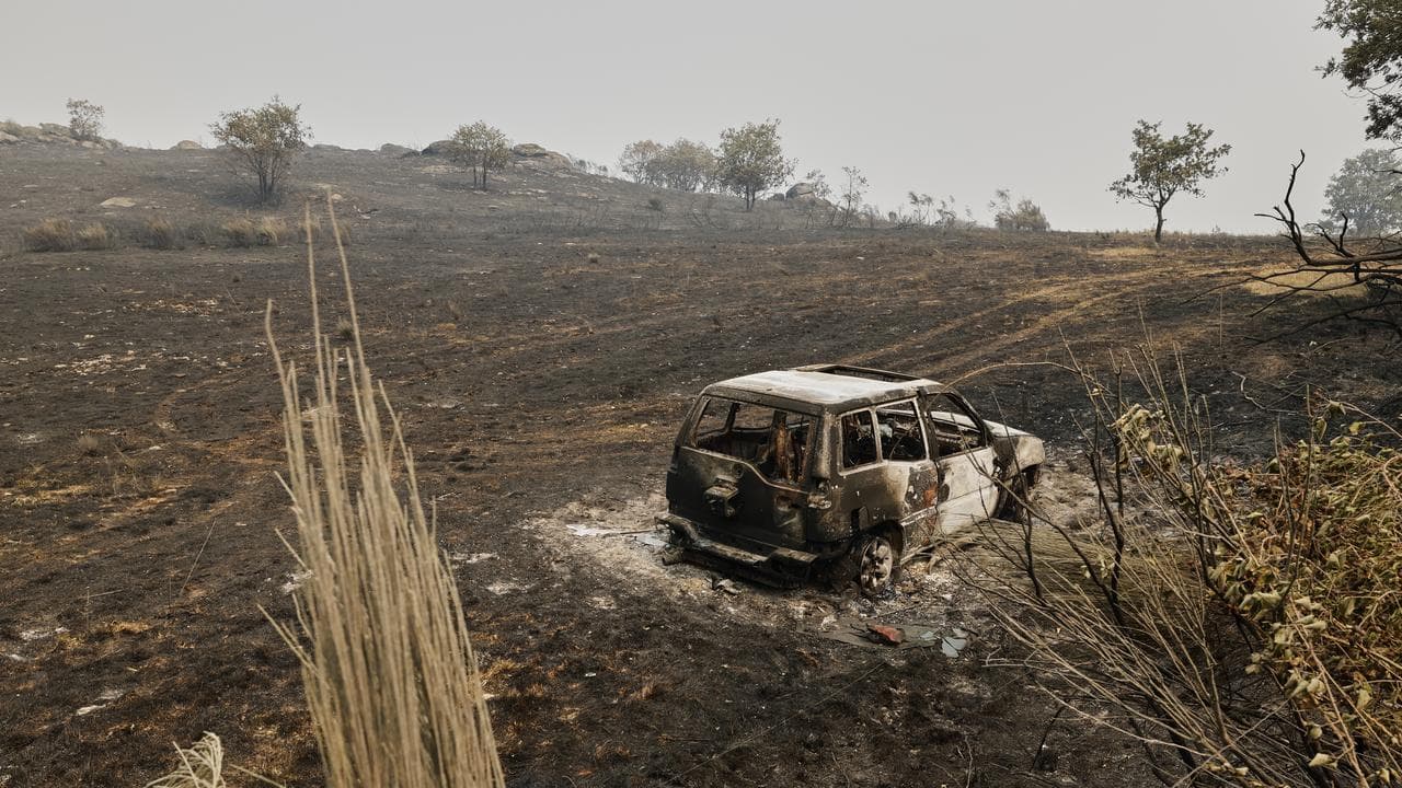 A charred car in northwestern Spain
