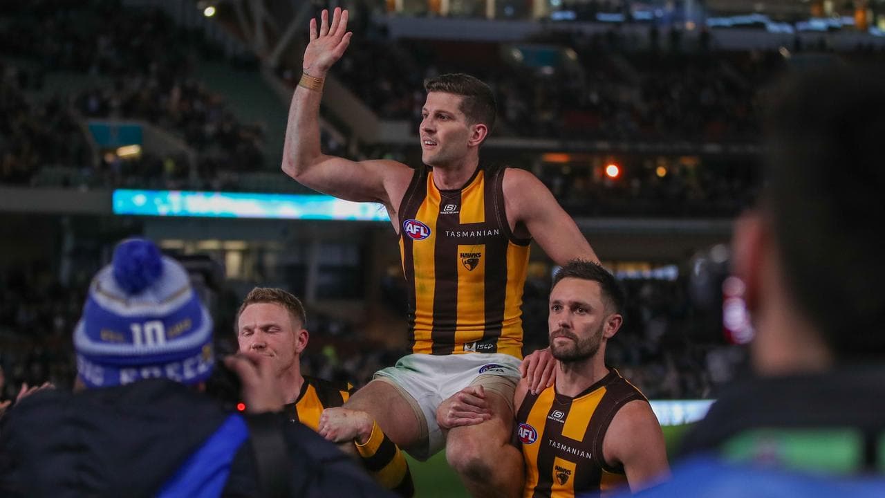 Luke Breust is chaired off the ground by James Sicily and Jack Gunston