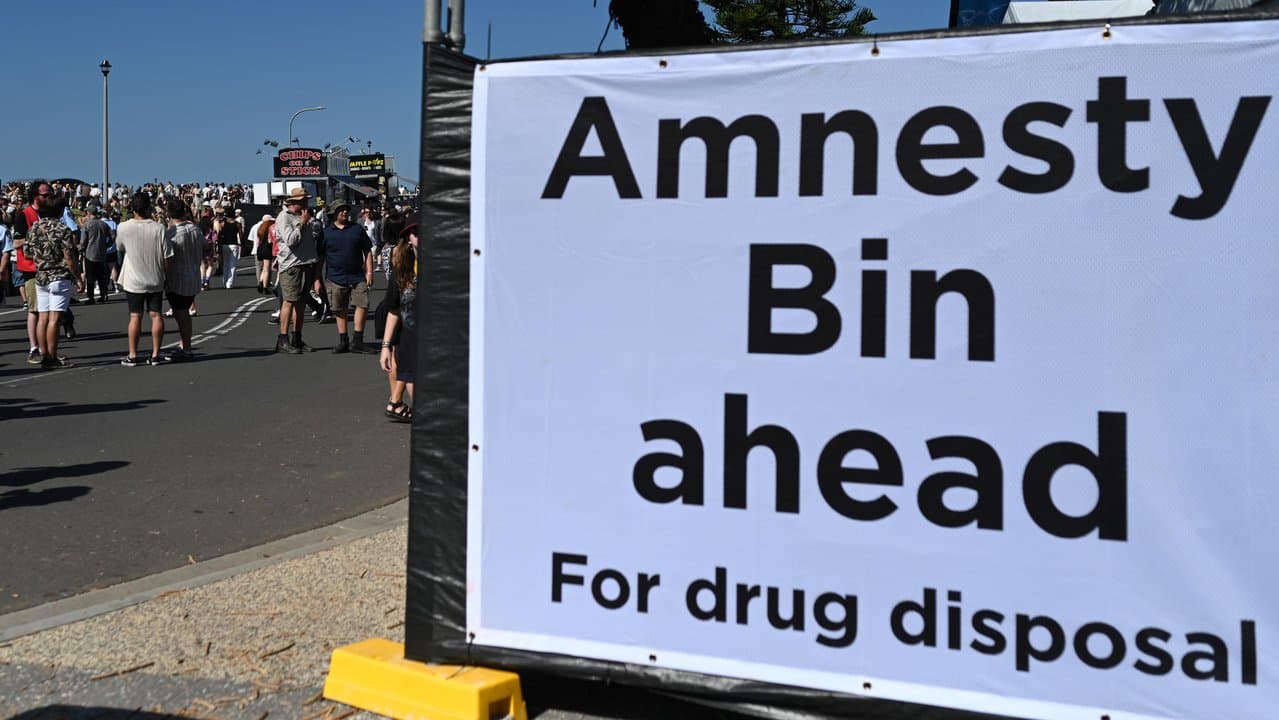 A drug amnesty bin sign at a music festival