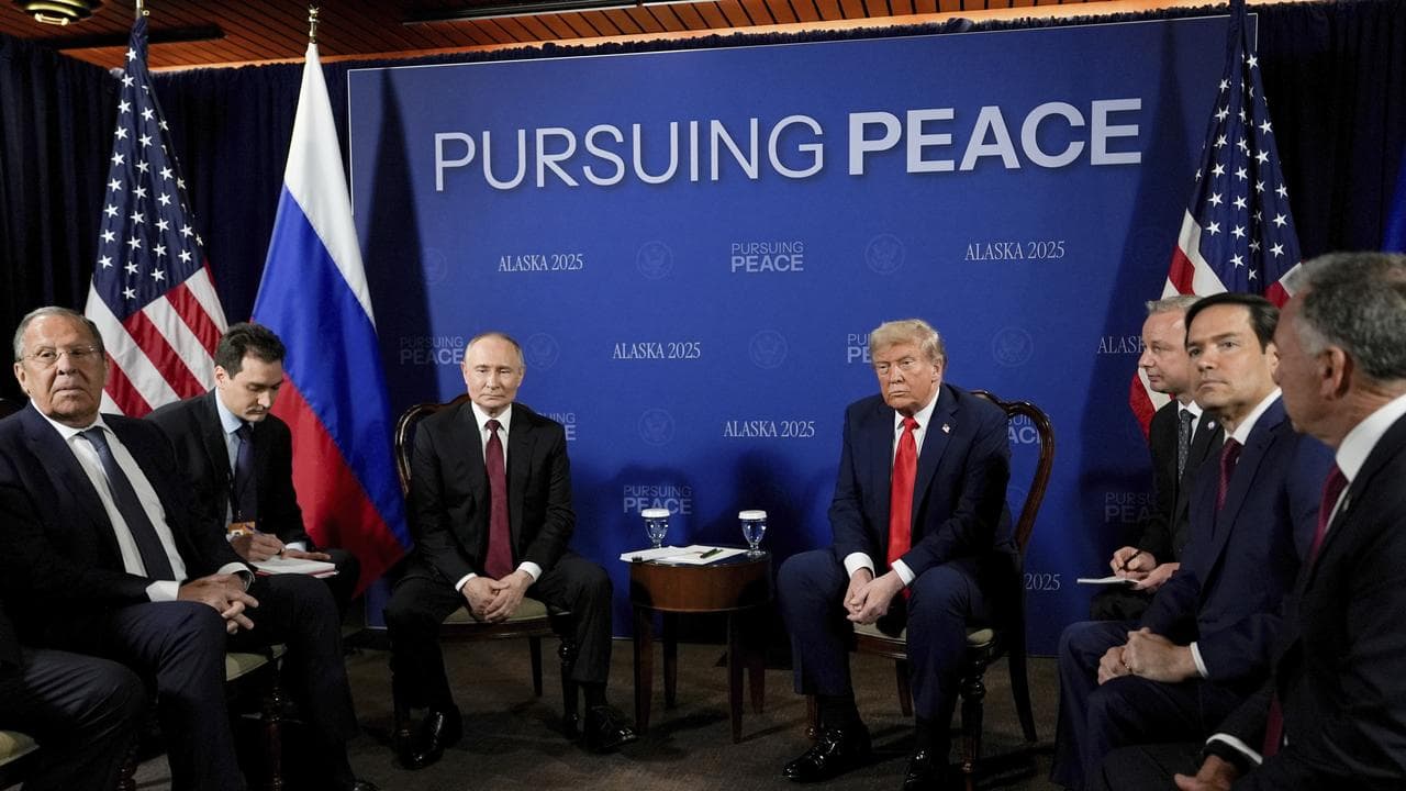 Donald Trump meets with Vladimir Putin