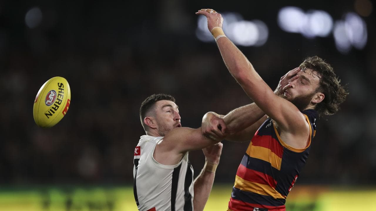 Collingwood's Daniel McStay and Adelaide's Riley Thilthorpe